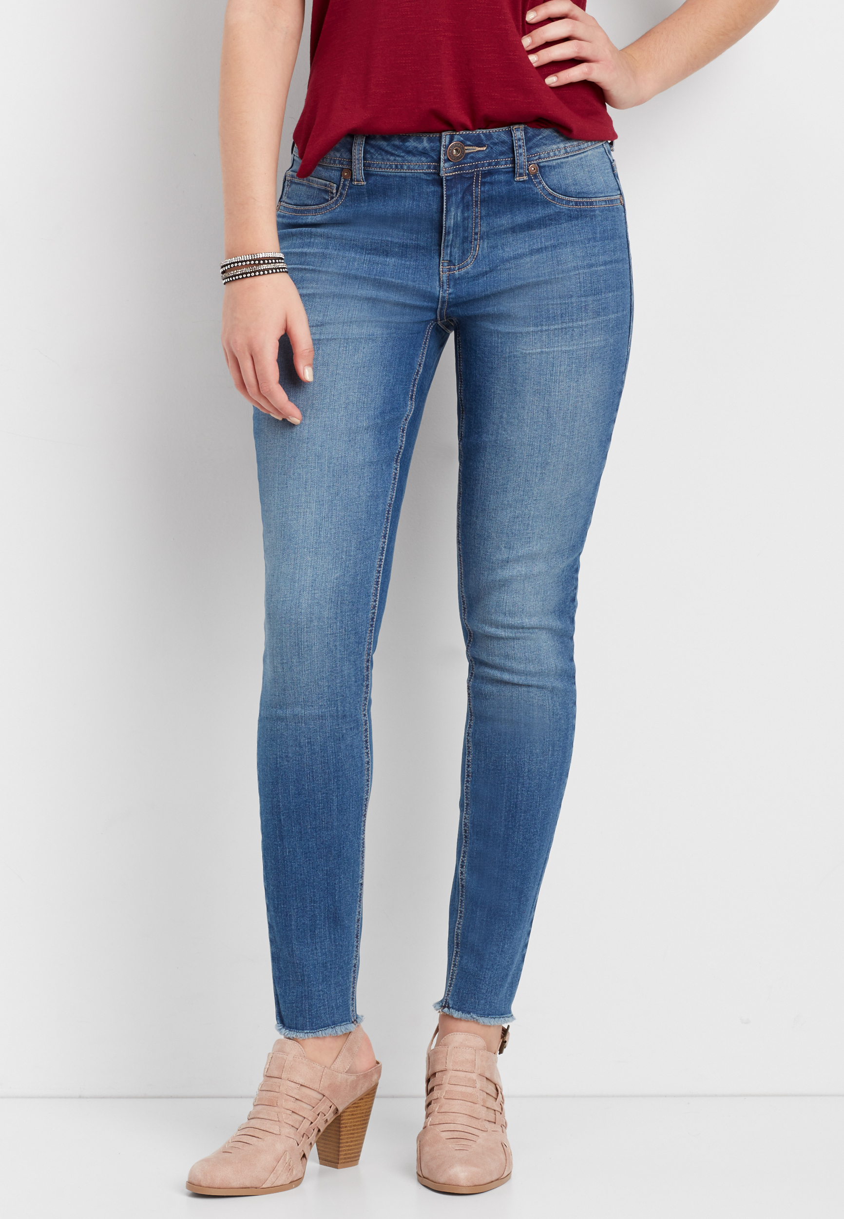 distressed mid rise skinny jeans