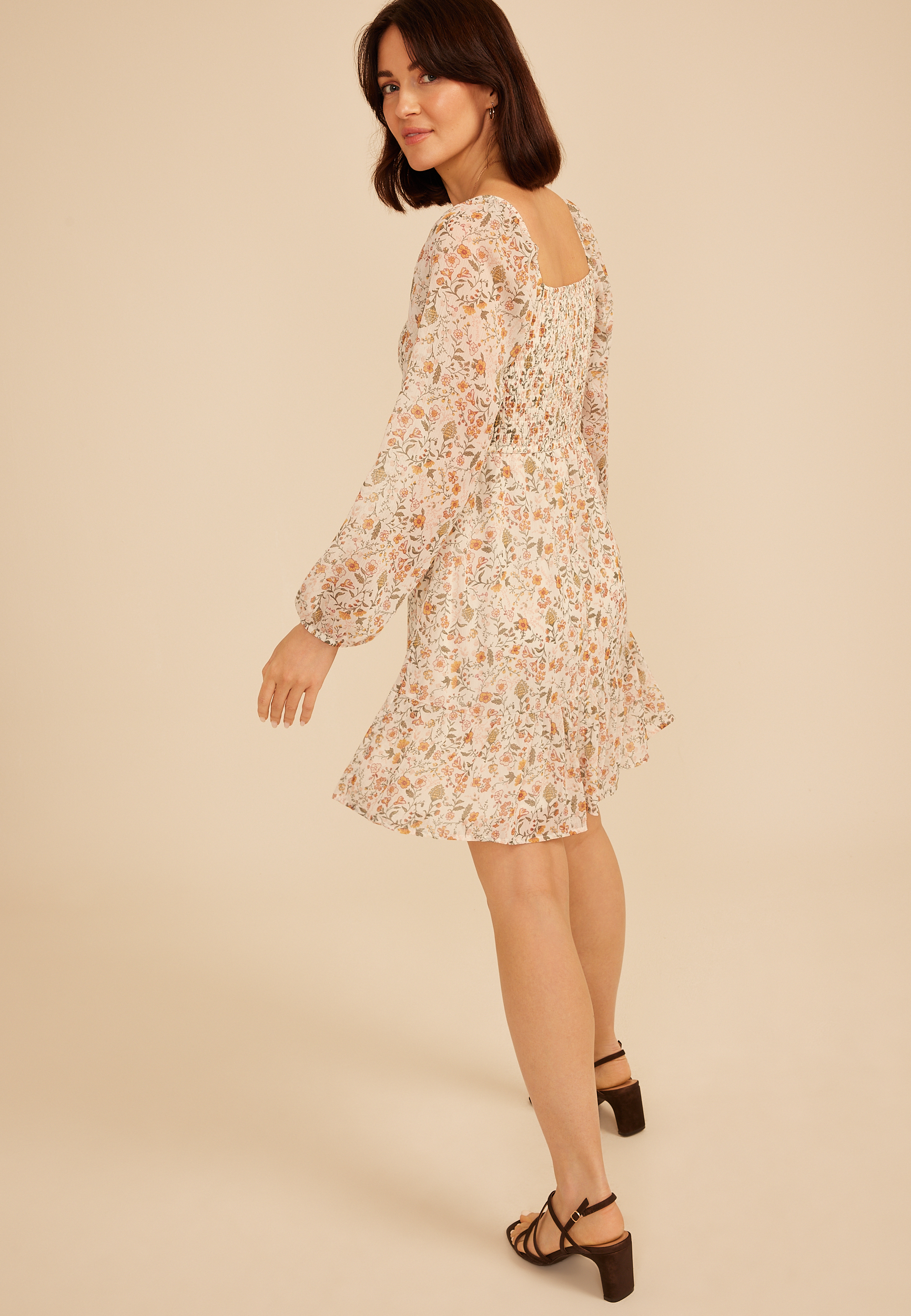 long sleeve babydoll dress Smocked It features a subtle V neckline Beige Raw Edge Bell Sleeve