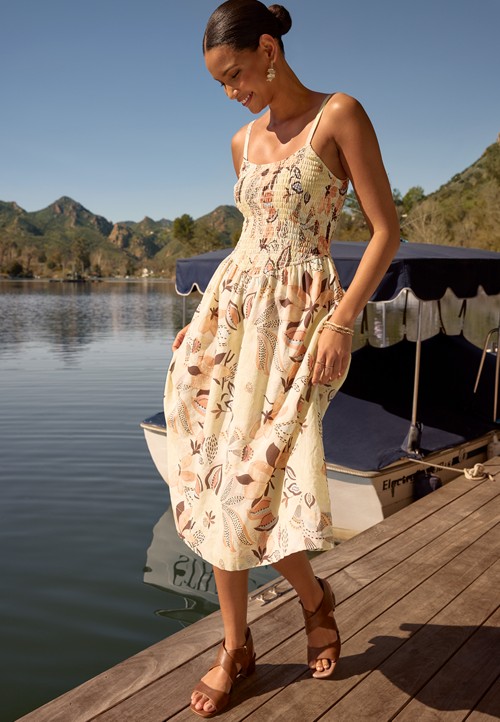 smocked midi dress Sweet Innocence lightweight polyester—ideal for spring and summer events. Lou Smocked Tiered Midi Dress