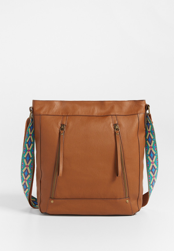 crossbody bag with guitar strap in cognac | maurices